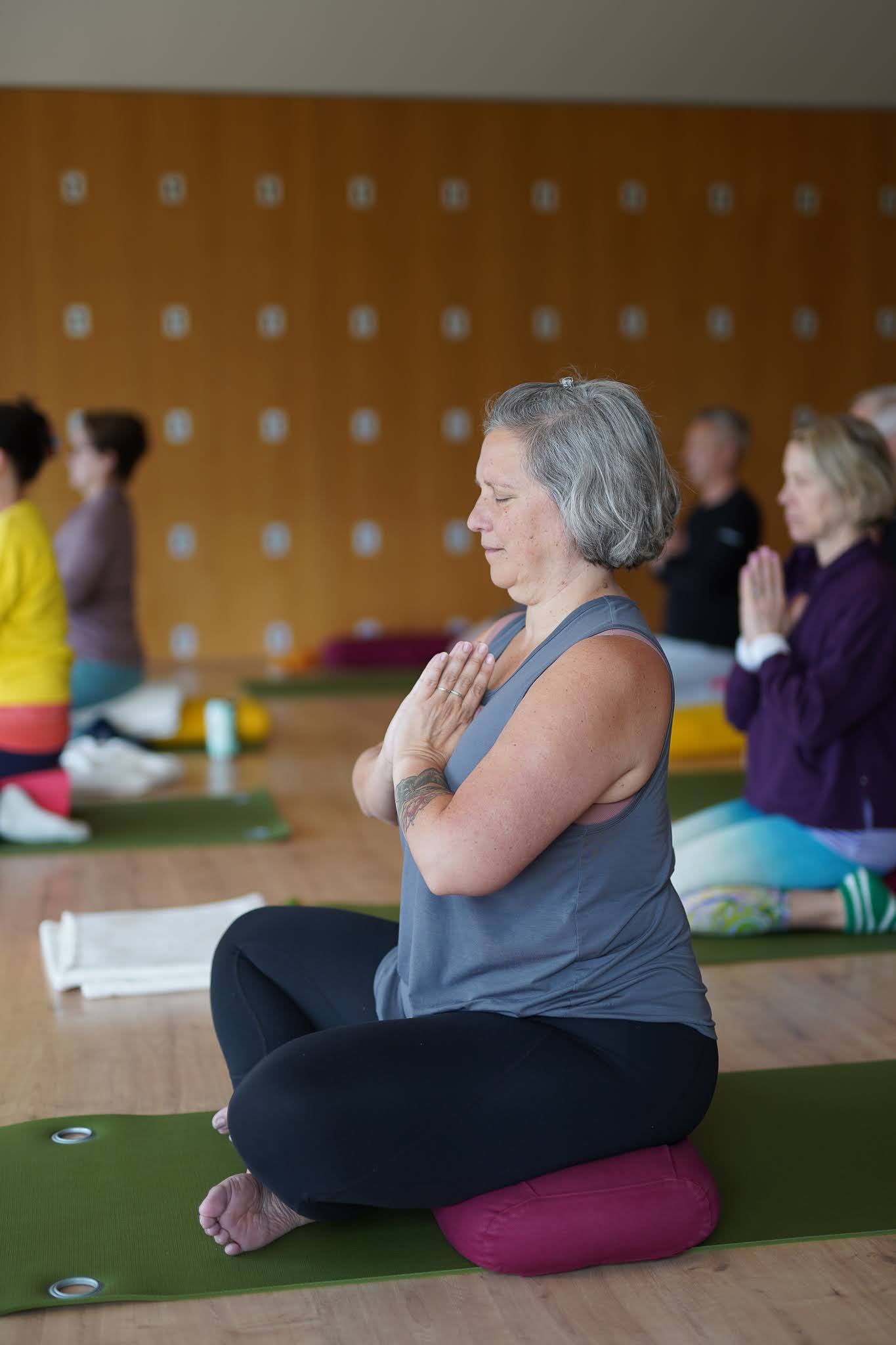 Helena sits in meditation
